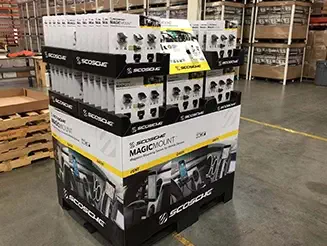Co-packed retail display showcasing Scosche MagicMount phone holders in a warehouse ready for distribution.
